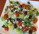 Greek Salad · Romaine lettuce, red onion, cucumber, cherry tomatoes, Kalamata olives and feta cheese.