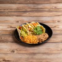 Tacos · Three soft shell corn, flour, or crispy corn tortillas with your choice of meat. Topped with...