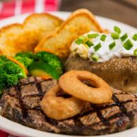 River City Ribeye · A tender, 10 oz. ribeye topped with breaded onion rings.