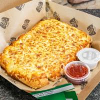 Cheezy Bread ·  Fresh-baked bread strips with our 3-cheese blend and garlic butter, served with a side of p...