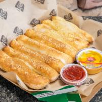 Break Sticks  · 8 pieces. Fresh-baked bread strips with garlic butter; topped with Parmesan and Roma Seasoni...