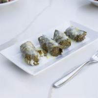 Dolmathes  yalantzi · Grape leaves stuffed with rice, tomatoes, parsley, onion cooked in lemon and olive oil.