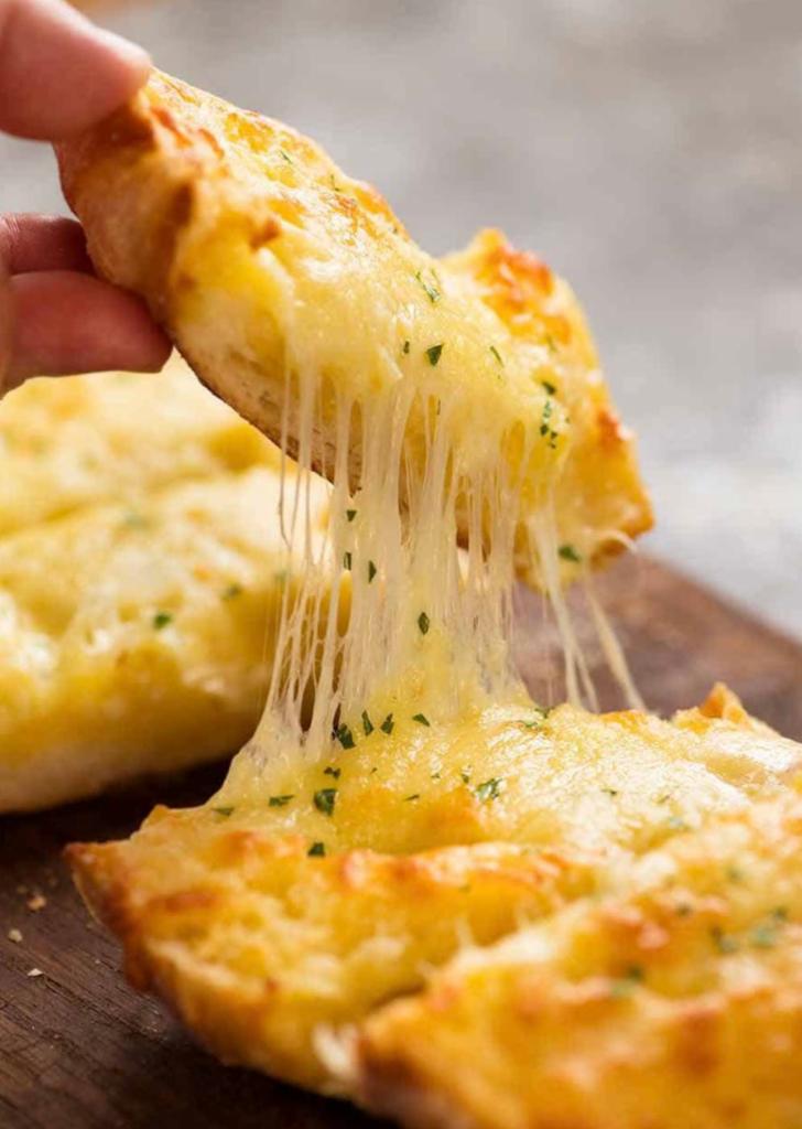 Garlic Bread with Cheese · Our ciabatta roll baked with our own garlic spread.