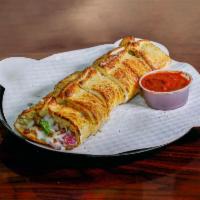 The Great Stromboli · Ham, bacon, onion, green peppers, with mozzarella and our signature ranch dressing.