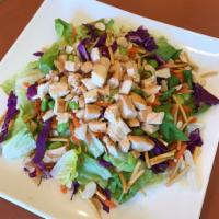 Chinese Chicken Salad · Crisp romaine lettuce, grilled skinless chicken breast, red cabbage, grated carrots, edamame...