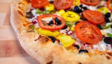 The Garden Pizza · Greek's Italian sauce, select blended cheeses, Spanish onions, green bell peppers, fresh domestic sliced mushrooms & sliced California black olives.