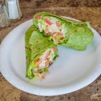 Grilled Chicken Avocado Club Wrap · Grilled chicken breast with bacon, avocado, mayonnaise, lettuce and tomato.