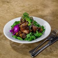 Cheffrey BBQ Baby Back Ribs · Fall off the bone pork ribs, twice cooked, tossed in a sesame soy glaze.