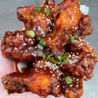 Classic Fried Chicken Wings · Classic fried chicken wings tossed in your choice of sauce or rub. 