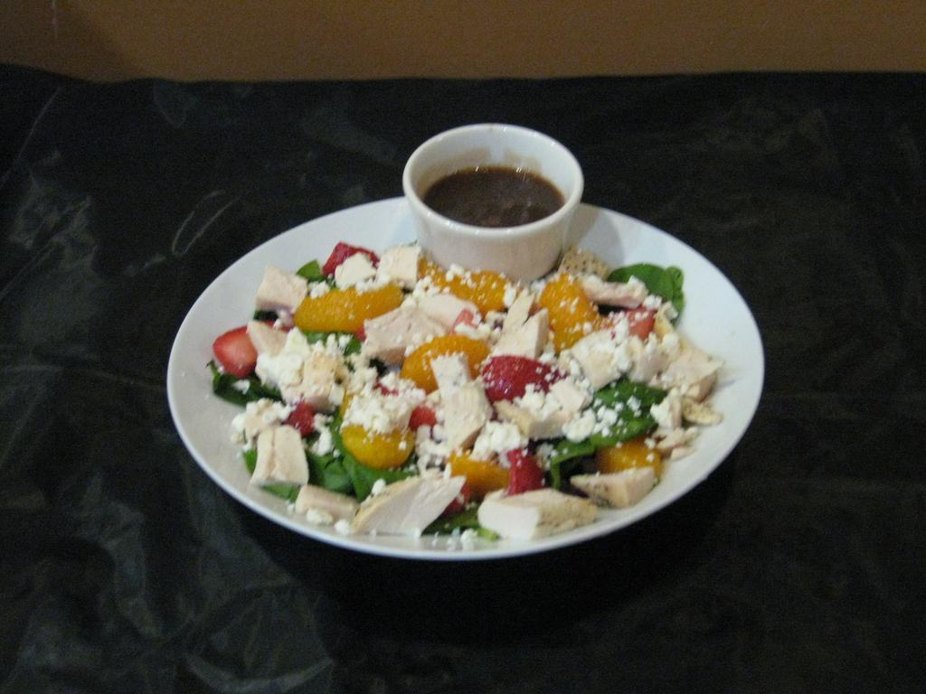 Spinach Salad with Chicken · Spinach, strawberries, mandarin oranges, onion, feta and balsamic dressing.