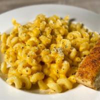 Manhattan Mac and Cheese · A large portion of cavatappi pasta mixed with creamy, melted cheddar cheese. Add bacon, fres...