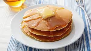 Pancakes · 3 fluffy pancakes with maple syrup and butter.