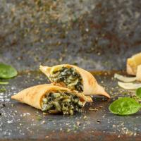 Spinach Empanadas · Creamed spinach, onion, mozzarella and spices.