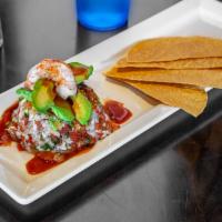 Ceviche Tower · Boiled shrimp diced with pico de Gallo mix and fresh lime juice.  2 tostadas and ceviche sau...
