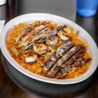 Ranchero Jalisco · Popular. Grilled shrimp, steak, and chicken.  Bed of rice, cooked with grilled onions, tomat...