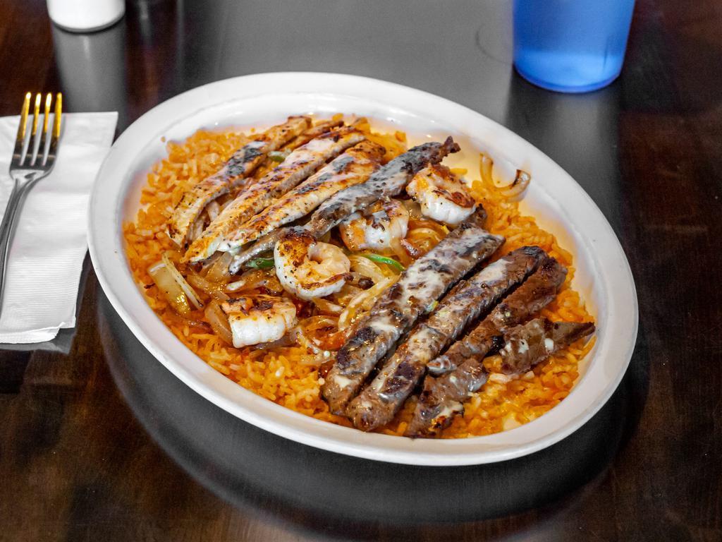 Ranchero Jalisco · Popular. Grilled shrimp, steak, and chicken.  Bed of rice, cooked with grilled onions, tomatoes, and bell peppers. Covered with cheese sauce.