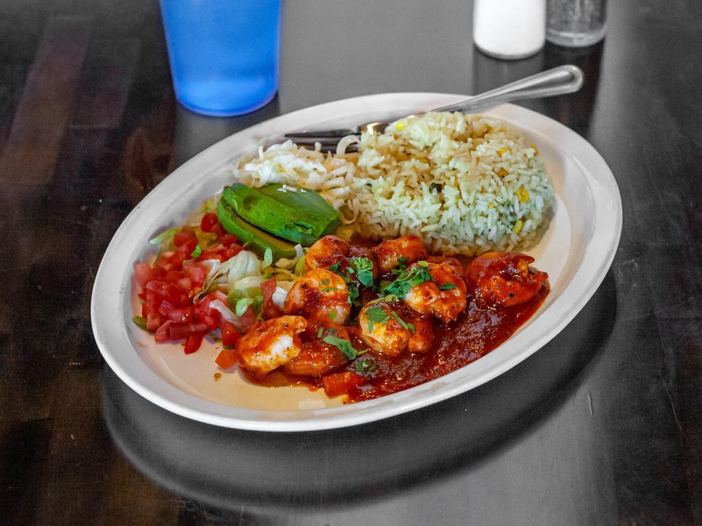 Camarones a la Diabla · Grilled shrimp covered in chipotle base sauce. Garnished with lettuce, avocado, diced tomatoes, and shredded cheese. Severed with white rice.