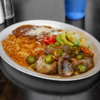 Carnitas · Pork tips carnitas. Garnished with lettuce, avocado, diced tomatoes, and tortillas. Served w...