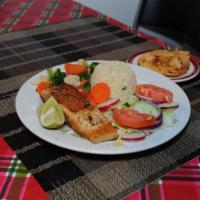 Grilled Salmon · Grilled Salmon with mixed veggies, rice and Garlic Bread.