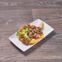 Beef Taco · Served with rice and beans.