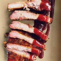 Baby Back Ribs · slow and low cherry wood smoked baby back ribs glazed in our original sauce 