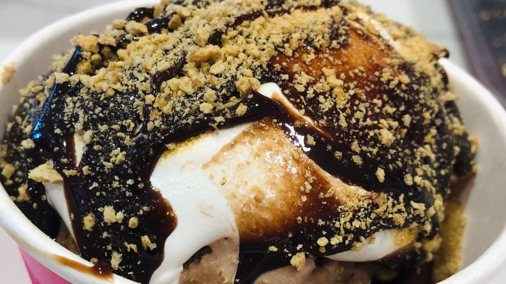 #5 Campfire S’mores Creation · Staff created and delicious! S’mores cookie dough, Chocolate ice cream, toasted marshmallow, hot fudge, and graham cracker crumbles on top. 