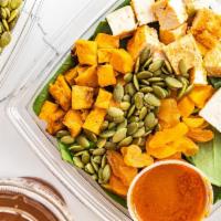 Harissa Chicken Salad · baby spinach, harissa roasted chicken, feta, roasted sweet potatoes, pumpkin seeds, dried ap...