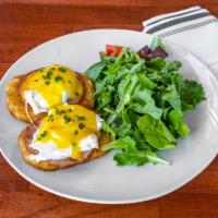 Poached Brabu · Hashbrown, poached egg, ham, hollandaise sauce; baby greens.