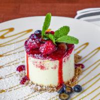Brabu Cheesecake · Yogurt, passion fruit glaze, fresh.