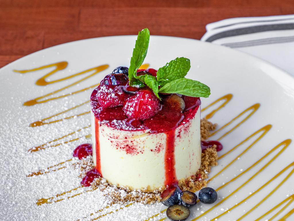 Brabu Cheesecake · Yogurt, passion fruit glaze, fresh.