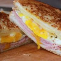 Grilled Ham Chezzer Jo Sandwich · Slice of grilled honey ham, an over easy egg, pepper jack cheese, lettuce, tomatoes and ligh...