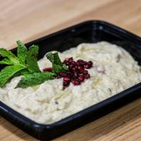 Baba Ghanoush Salad · Fresh eggplants grilled and ground with parsley, garlic, tahini, and a hint of spice.