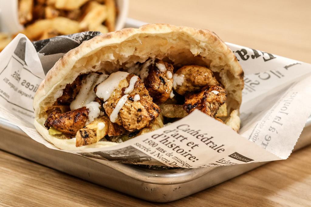 DXB Tawook Sandwich · Grilled tender chicken cubes with fries, coleslaw, ketchup and hint of garlic