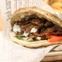 Gyro Sandwich · Grilled gyro meat mix, tzatziki sauce, lettuce, tomatoes and pickles.