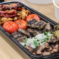 Mix Grill · Assorted made to order grilled Lamb Tikka, Lamb and beef Kafta, Chicken Tawook served with R...