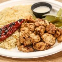 Chicken Tawook Plate · Grilled tender chicken cubes marinated in tawook spices served with babel rice or fries + 1 ...