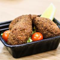 Kibbeh (4 Count) · 4 counts. Kibbeh mixture of bulgur wheat, onions,  ground beef, and lamb forms a hollow shel...