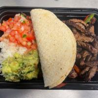 Steak Fajitas · Skirt steak, pepper, onions, guacamole and pico. Rice and tortillas.