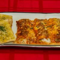 Homemade Cannelloni  · Stuffed crepe pasta, baked in Bolognese sauce, and topped with whole milk mozzarella cheese.
