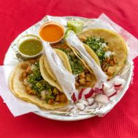 Tacos · 3 soft shell tacos served with onions and cilantro. Made with choice of steak, chicken, pork...