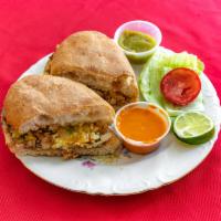 Mexican Torta · Mexican style sandwich made with lettuce, tomatoes, mayo, choice of meat and beans served on...
