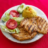 Chicken or Steak Meal · Grilled chicken or steak served with rice, beans, lettuce, tomatoes, and hand made tortillas.