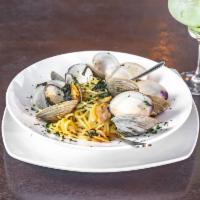 Linguine alle Vongole · Linguine pasta sauteed with fresh clams in white wine and garlic sauce or a marinara sauce.