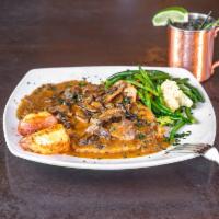Vitello Florio · Veal scaloppini sauteed with mushrooms and finished in a light Marsala wine glaze.