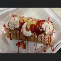 Strawberry & Creme Crepe · Strawberry crepe incluye whipped cream strawberries strawberry shyrup y azúcar blanca 
