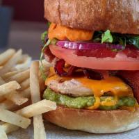 Lava Chicken Sandwich · Grilled or fried chicken, guacamole, bacon, cheddar, lettuce, tomato, onion, house made hot ...