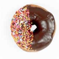 Plain Chocolate-Frosted · Our classic Plain Donut…blanketed with our house-made chocolate frosting and sprinkled with ...