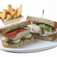 Pesto Chicken Sandwich · With grilled chicken breast, pesto sauce, tomatoes, fresh Mozzarella and fresh basil on whea...