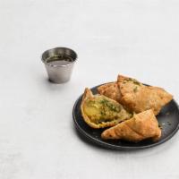 1. Two Pieces Vegetable Samosa · Spicy turnovers stuffed with potatoes and green peas.