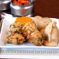 6. Palace Platter · Combination of vegetable pakora, samosa and tikki paneer pakoras served with chutney.